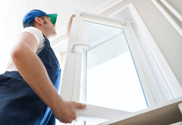 Window installation technician installing a window